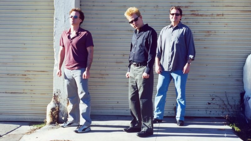 Band portrait against a garage door